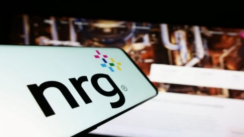 NRG Energy logo displayed with power infrastructure imagery in the background